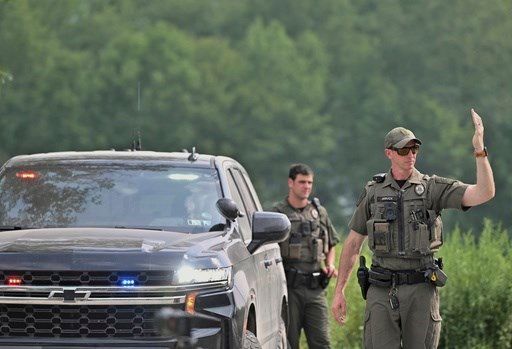 Shooter kills neighbor, wounds 2 troopers and is shot to death in rural Pennsylvania ambush