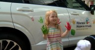 Childhood cancer patients decorate vehicle with handprints in celebration of Hyundai grant