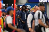 CeeDee Lamb takes big hit from sprinting official while WR is in street clothes on the sideline