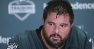 Eagles' Landon Dickerson serves beers at practice while recovering from knee surgery