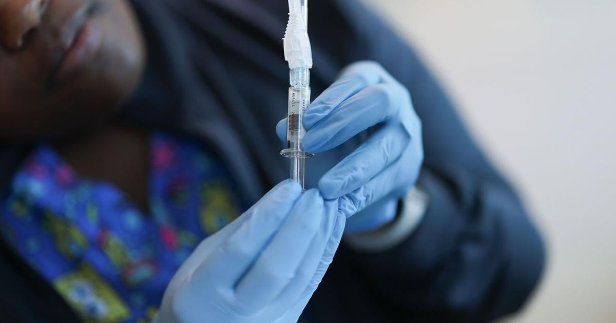FDA approves updated Covid-19 vaccines for limited groups as US cases continue to rise