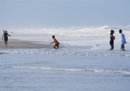 Summer celebrations meet closed beaches and warnings on East Coast due to Hurricane Erin