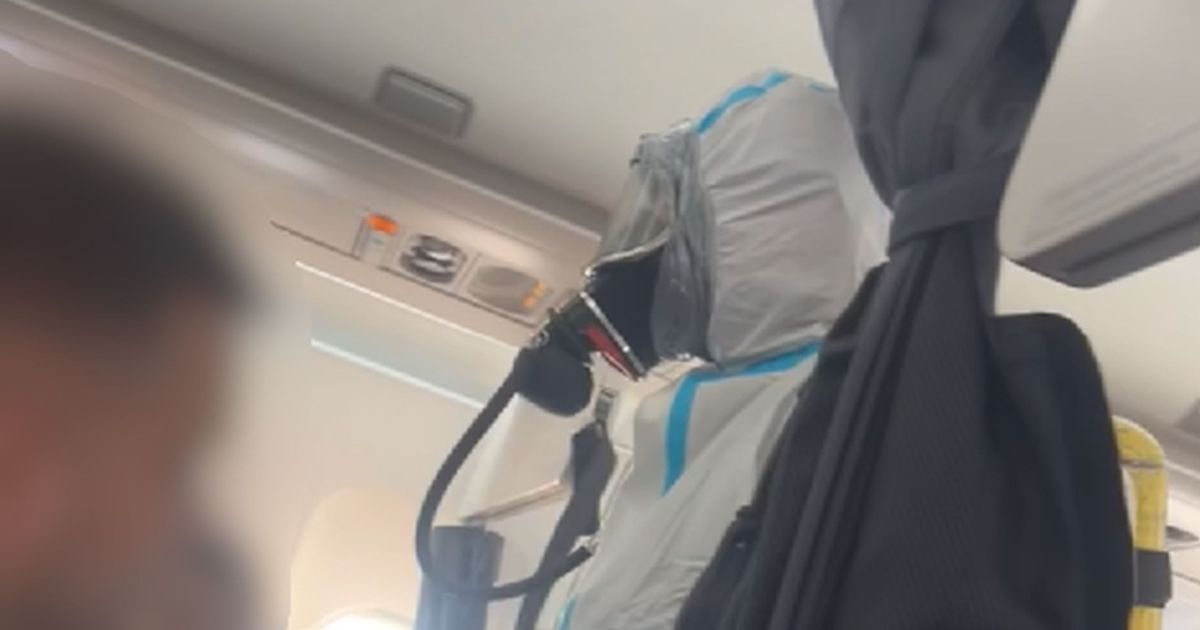 Flight 'pandemonium' as hazmat suit-clad firefighters storm British Airways plane