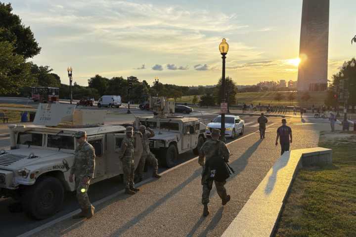 DC residents protest as White House says federal agents will be on patrol 24/7