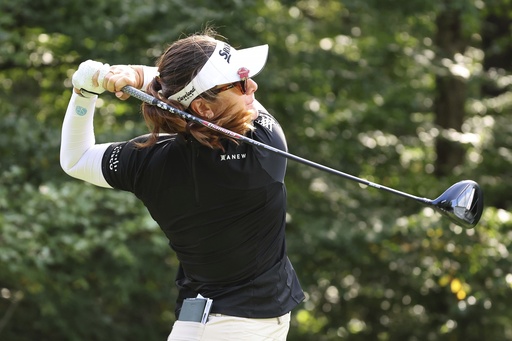 Miranda Wang waits a long time for a short birdie and leads rain
