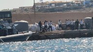 A boat carrying migrants capsizes off Italy, killing at least 26