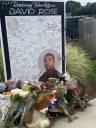 CDC supporters gather near scene of shooting, mourners leave flowers