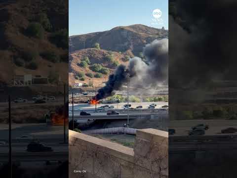 Smoke billows after semi-truck carrying Teslas catches fire