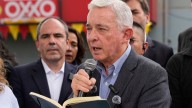 Colombian ex-leader known for contentious war on rebels pays tribute to slain presidential hopeful