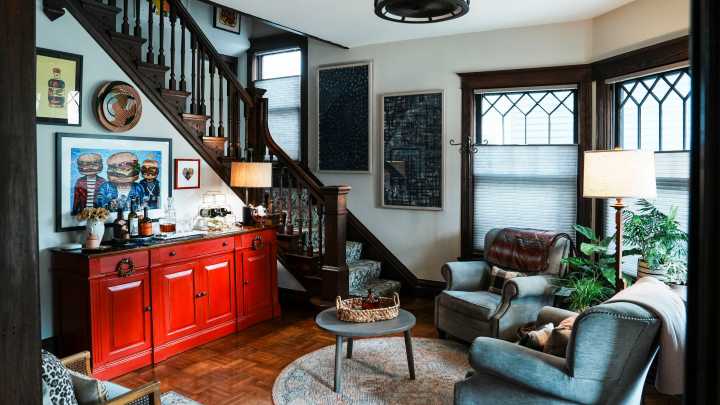 Restored 1904 Queen Anne home features original parquet floors & more