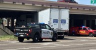 Driver cited after 18-wheeler lodges under SPID overpass