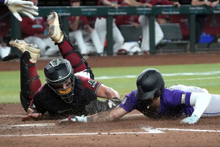 Diamondbacks rake woeful Rockies for 13 runs with two outs
