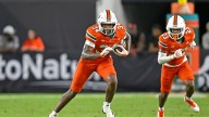 College football star charged with vehicular homicide over crash which killed three including two children