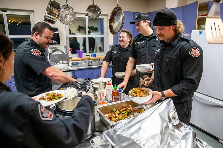 Everett firefighters turn on the burner and fire up the grill