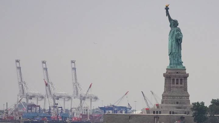 Trump's new tariffs go into effect as US economy shows signs of strain