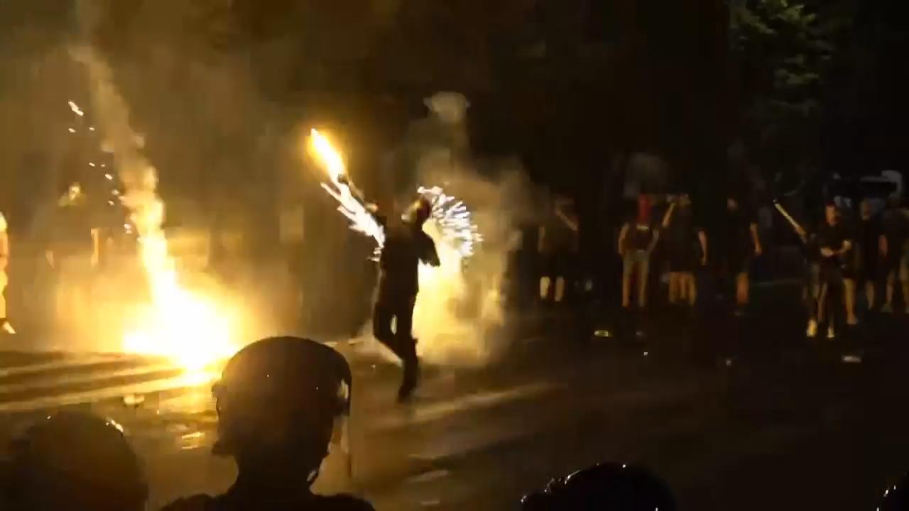 Clashes between anti-government protesters and riot police in Belgrade