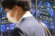 Asian shares decline following Wall Street’s dip