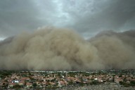 Towering wall of dust rolls through metro Phoenix, leaving tens of thousands without power