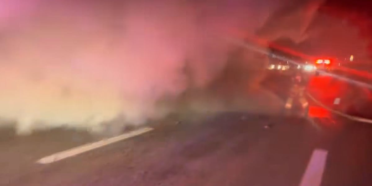 Firefighters extinguish car fire