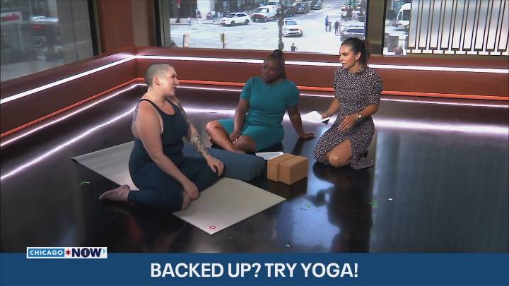 Yoga instructor teaches poses for digestion