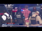Man arrested near deadly Emory Point shooting scene