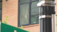 Gunfire hits Navy Yard apartment building