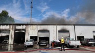 Crews battle auto shop fire in Gwinnett County