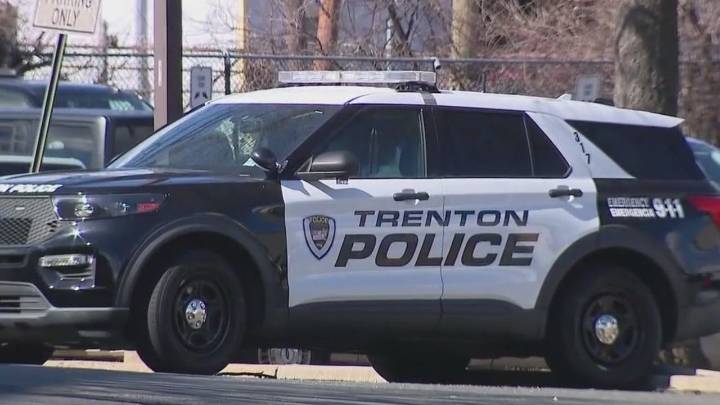 Man shot while driving in Trenton, hits police car, injures pedestrian