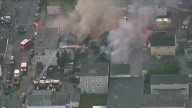 Fire hydrants, heat pose challenges as fire tears through city block