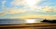 Woman on inflatable crocodile and teens on mattress blown out to sea on Scots beach