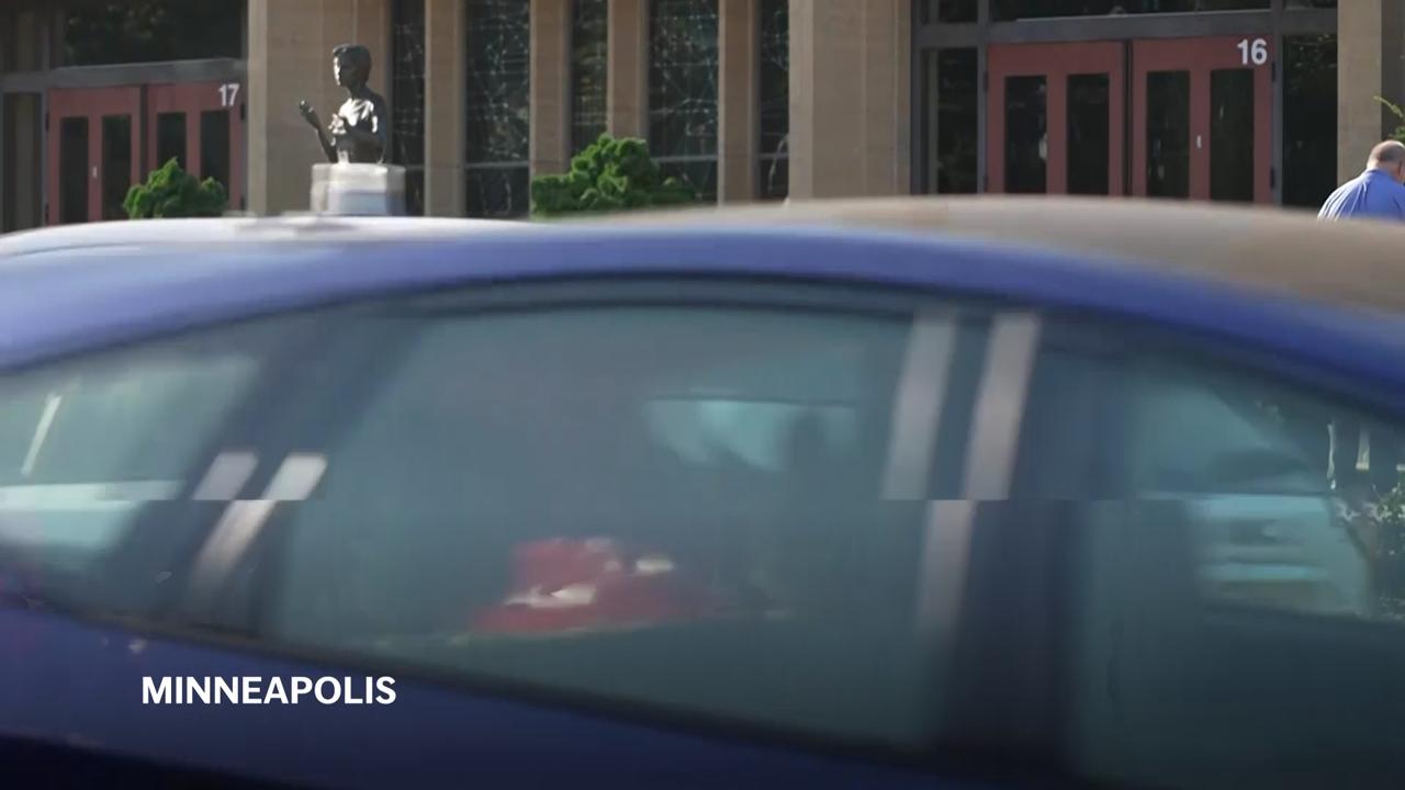 Memorial with flowers, crosses at Catholic church where two children killed in shooting