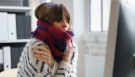 Woman Transitions From Being Cold Due To Weather To Being Cold Due To Air Conditioning