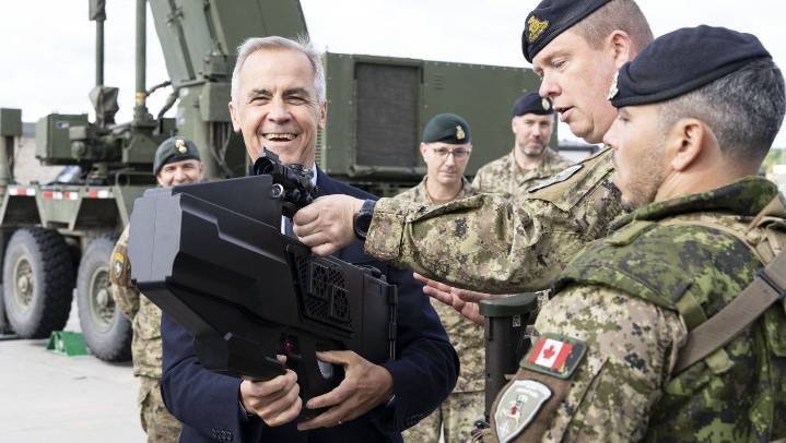 Carney tours Latvian military base to wrap up European trip