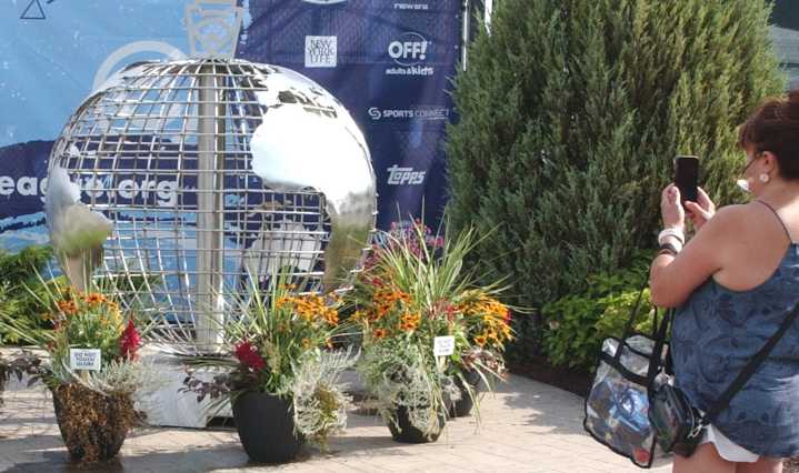 Stainless steel globe drawing attention of Little League World Series fans