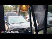 Food influencers filming as car plows into restaurant, sending them flying