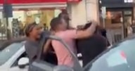 'Road rage' erupts into brawl as woman put in headlock and driver chased down