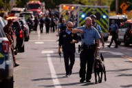 Hundreds honor 2 children killed and 17 people wounded in shooting at a Minneapolis Catholic school