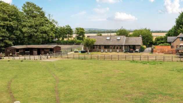 A home complete with swimming pool, stables and more