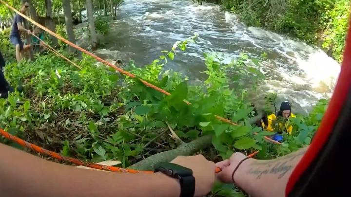 Watch two men get rescued from raging Wisconsin river