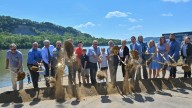 DeWine highlights Portsmouth riverfront project, Ohio River cleanup barge