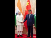 Rivals Xi and Modi Pledge Closer Ties