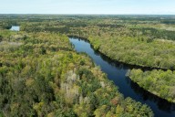 Man charged after he pushed boy, 13, into river, where he drowned: police