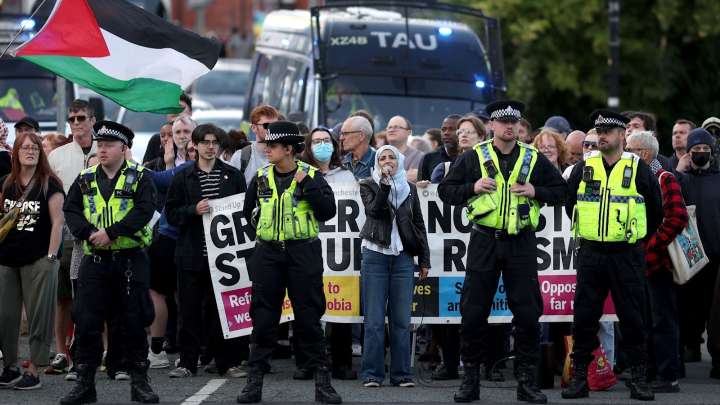 Rival protesters clash outside asylum seeker hotel