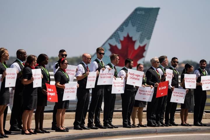 Air Canada flight attendants picket at 4 major airports in what union calls national day of action
