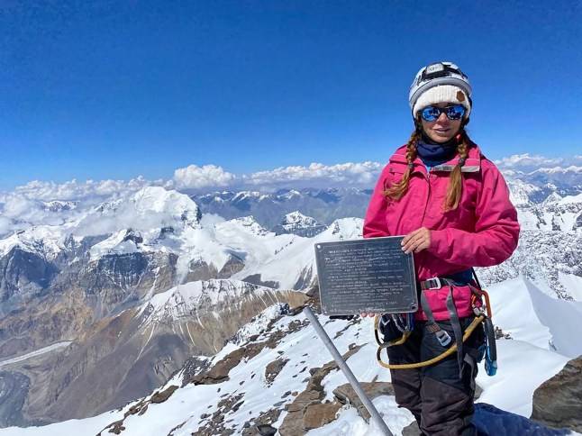 Bid to rescue woman stuck 22,000ft up mountain called off after man dies trying to save her