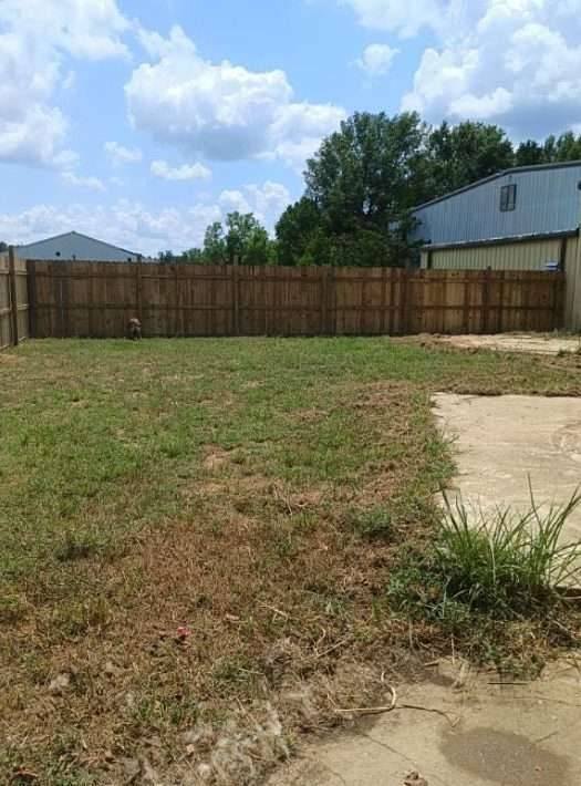 STEPPING UP TO SERVE: Volunteers Build New Fence for Dogs at Jackson Animal Shelter