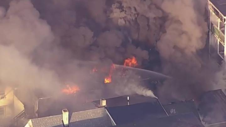 Crews respond to massive fire in Lawrence