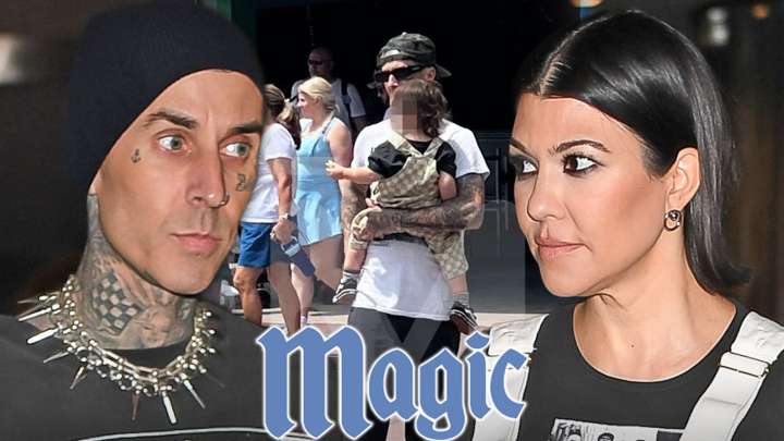 Travis Barker Holds Son Rocky, Hangs Out with Family at Magic Kingdom