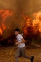 Spain battles record wildfires even as the end of a heat wave brings lower temperatures