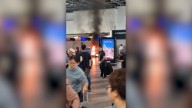 Panic in Milan airport as man sets fire to check